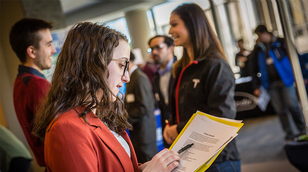 Students and employers at a career fair 